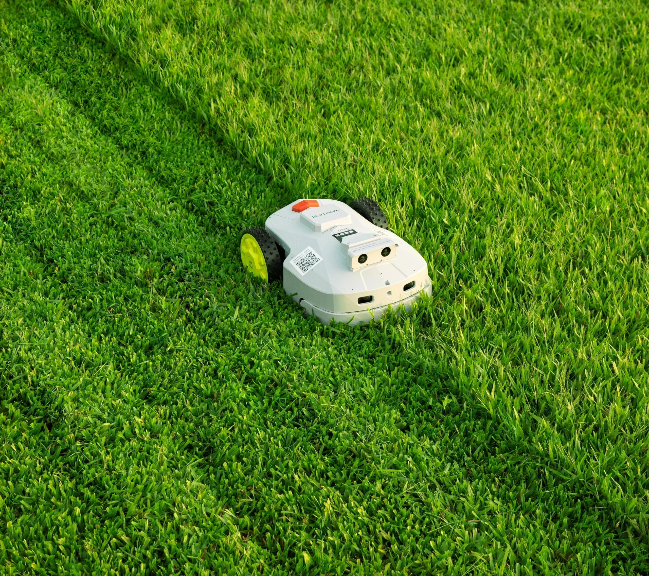 BESTMOW Titan-100 robotic lawn mower viewed from above on grass